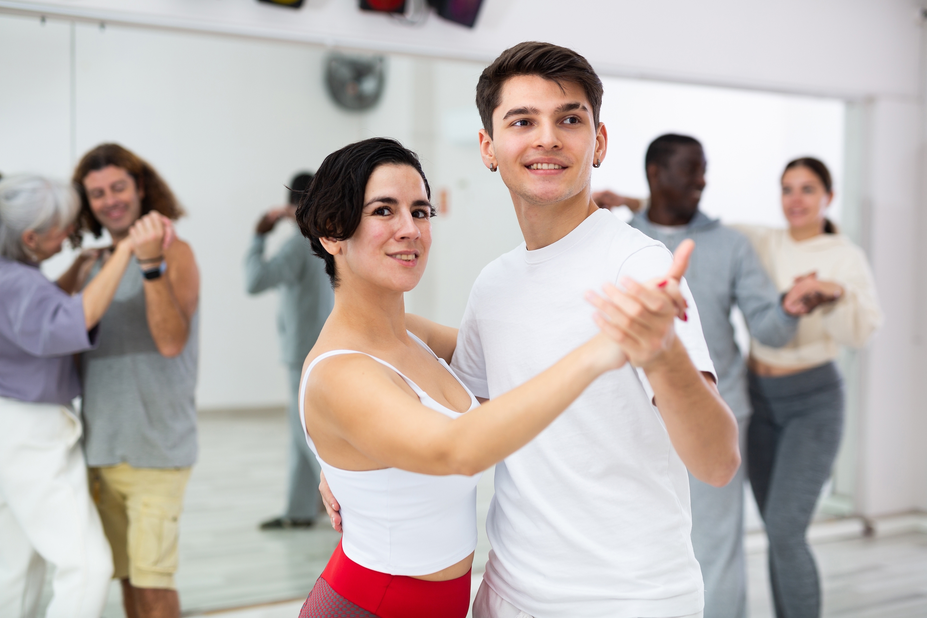Joyful salsa dancing at Fit Leopard